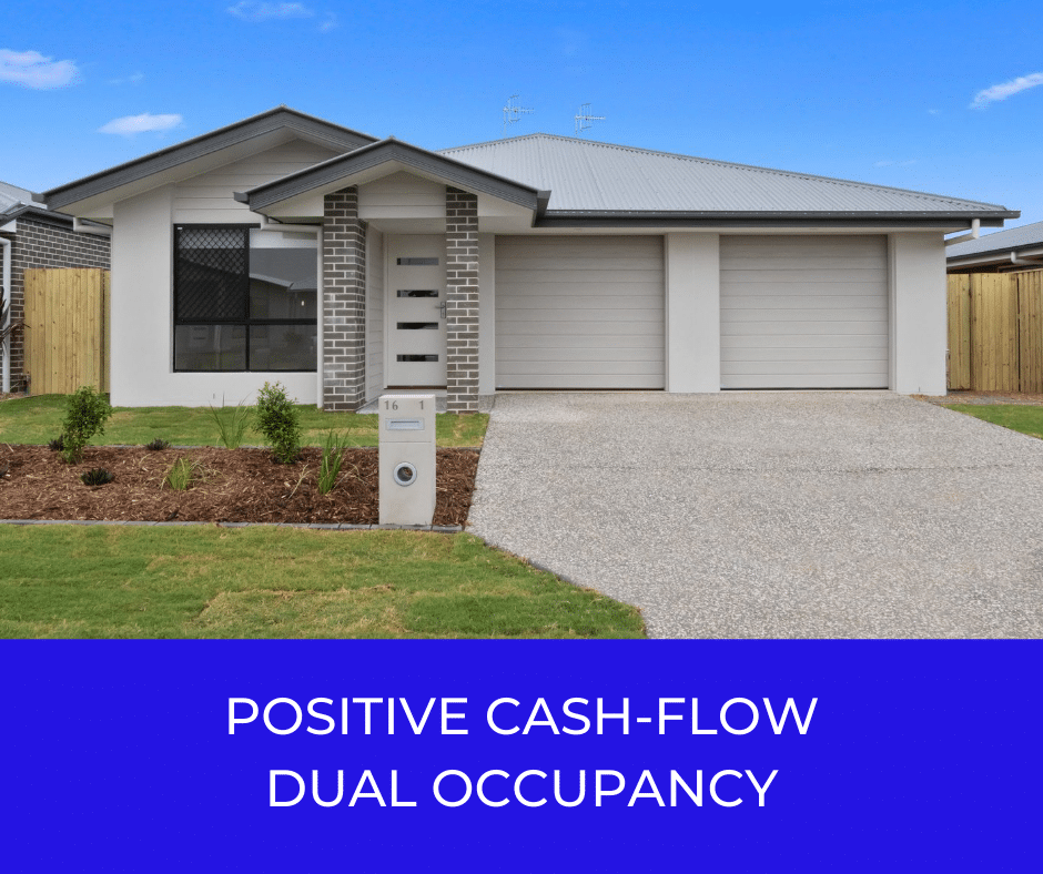 Modern dual occupancy house with garages and landscaped yard.