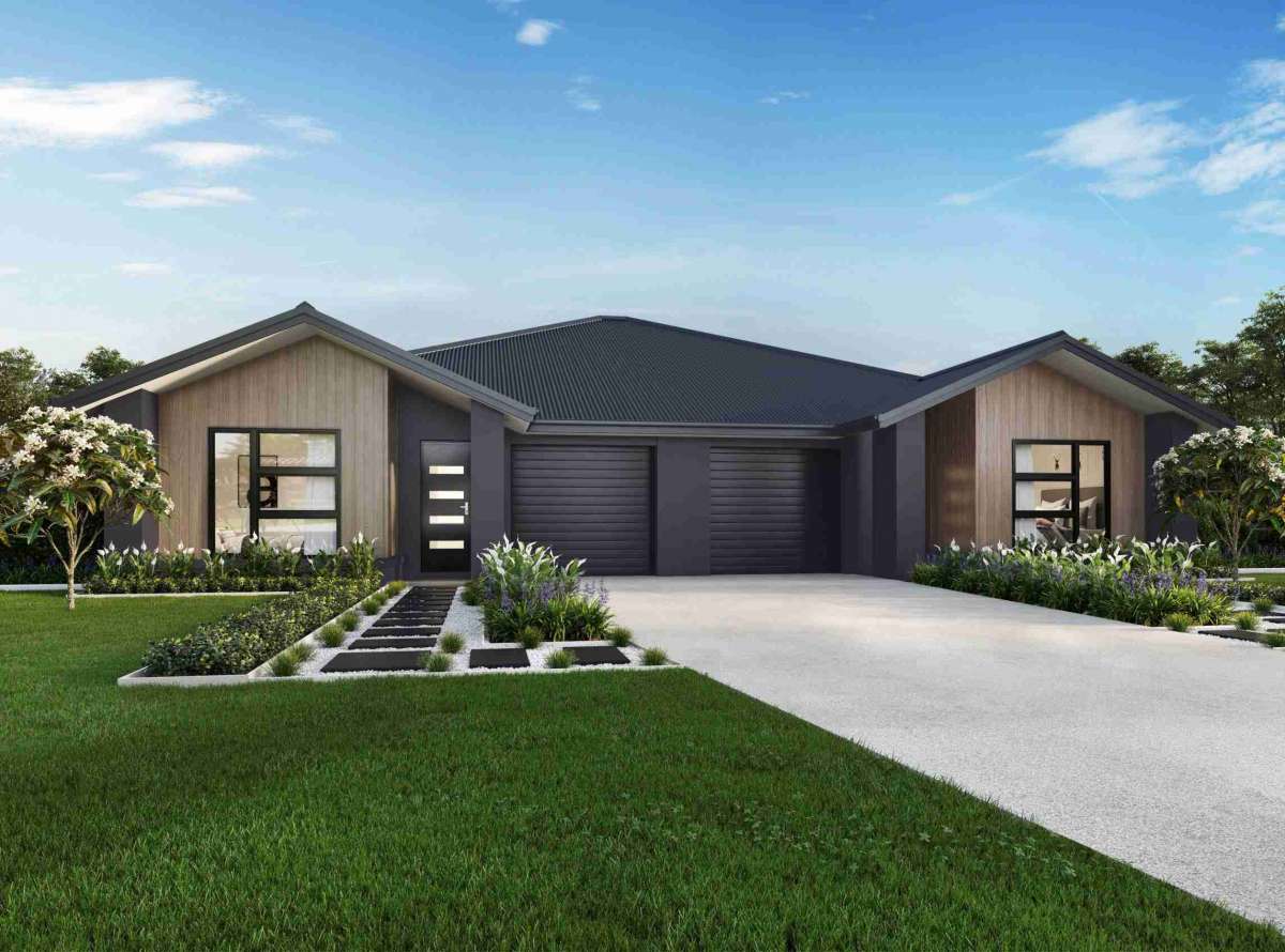 Modern single-story duplex with symmetrical design, pitched roofs, and lush landscaping.